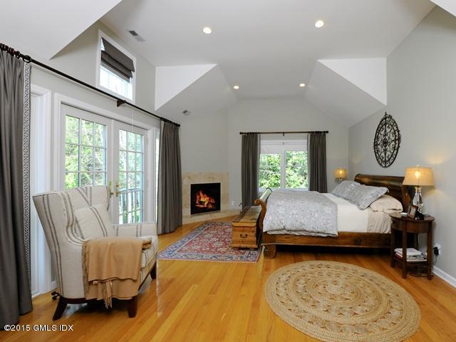 10 Tyler Lane Riverside, CT 06878 - Photo 12 of 25 a living room with furniture and a fireplace