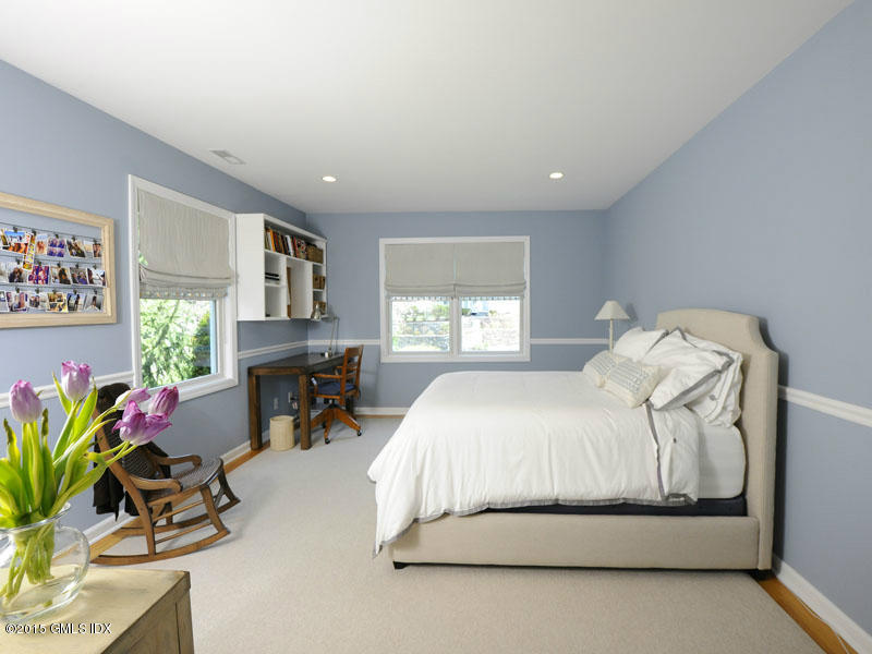 10 Tyler Lane Riverside, CT 06878 - Photo 15 of 25 a spacious bedroom with a bed and a window