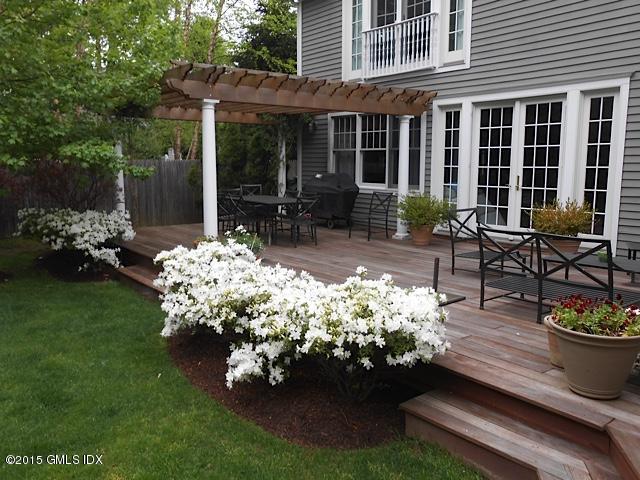 10 Tyler Lane Riverside, CT 06878 - Photo 23 of 25 a view of a porch with dining table barbeque and potted plants