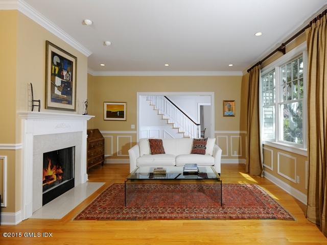 10 Tyler Lane Riverside, CT 06878 - Photo 4 of 25 a living room with furniture or couch and a fireplace