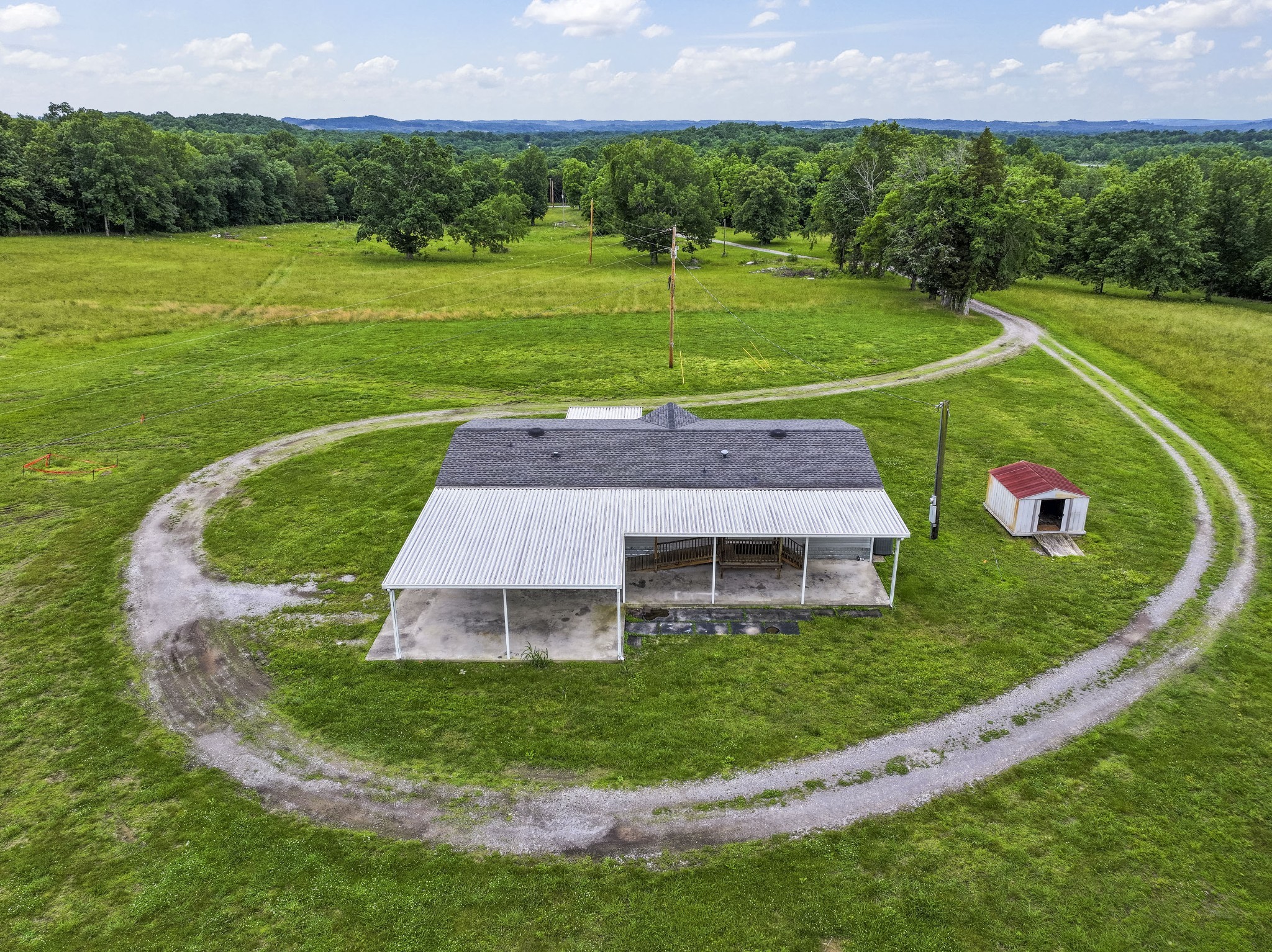 439 Philippi Road Wartrace, TN 37183 - Photo 16 of 29 a view of a big house with a big yard and potted plants