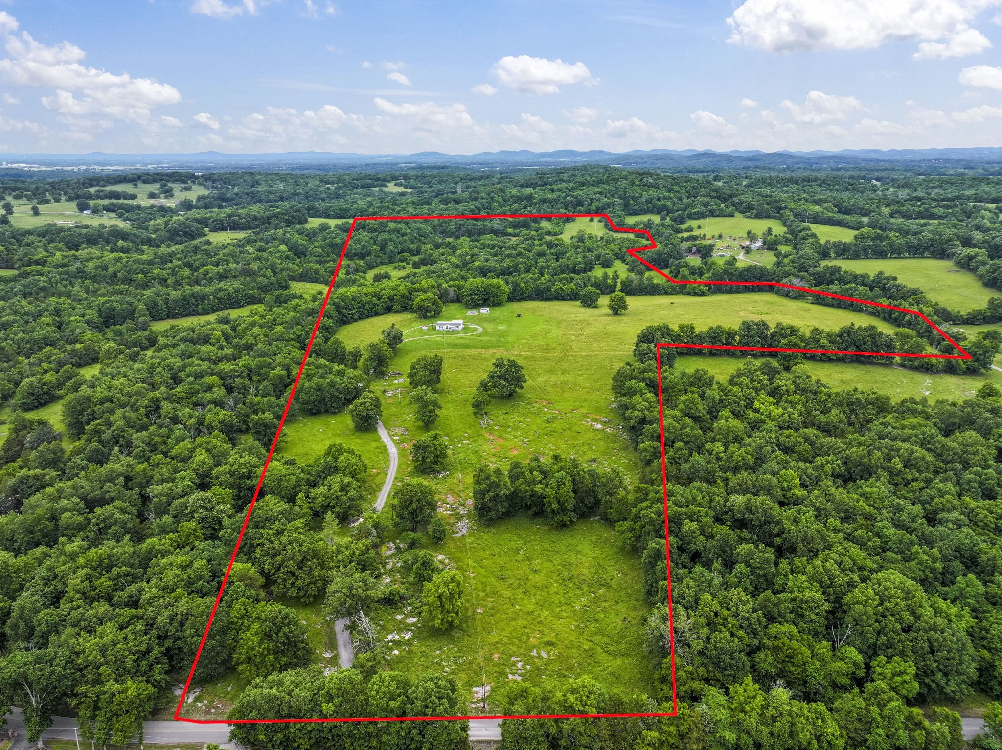 439 Philippi Road Wartrace, TN 37183 - Photo 2 of 29 a view of a city with lush green forest