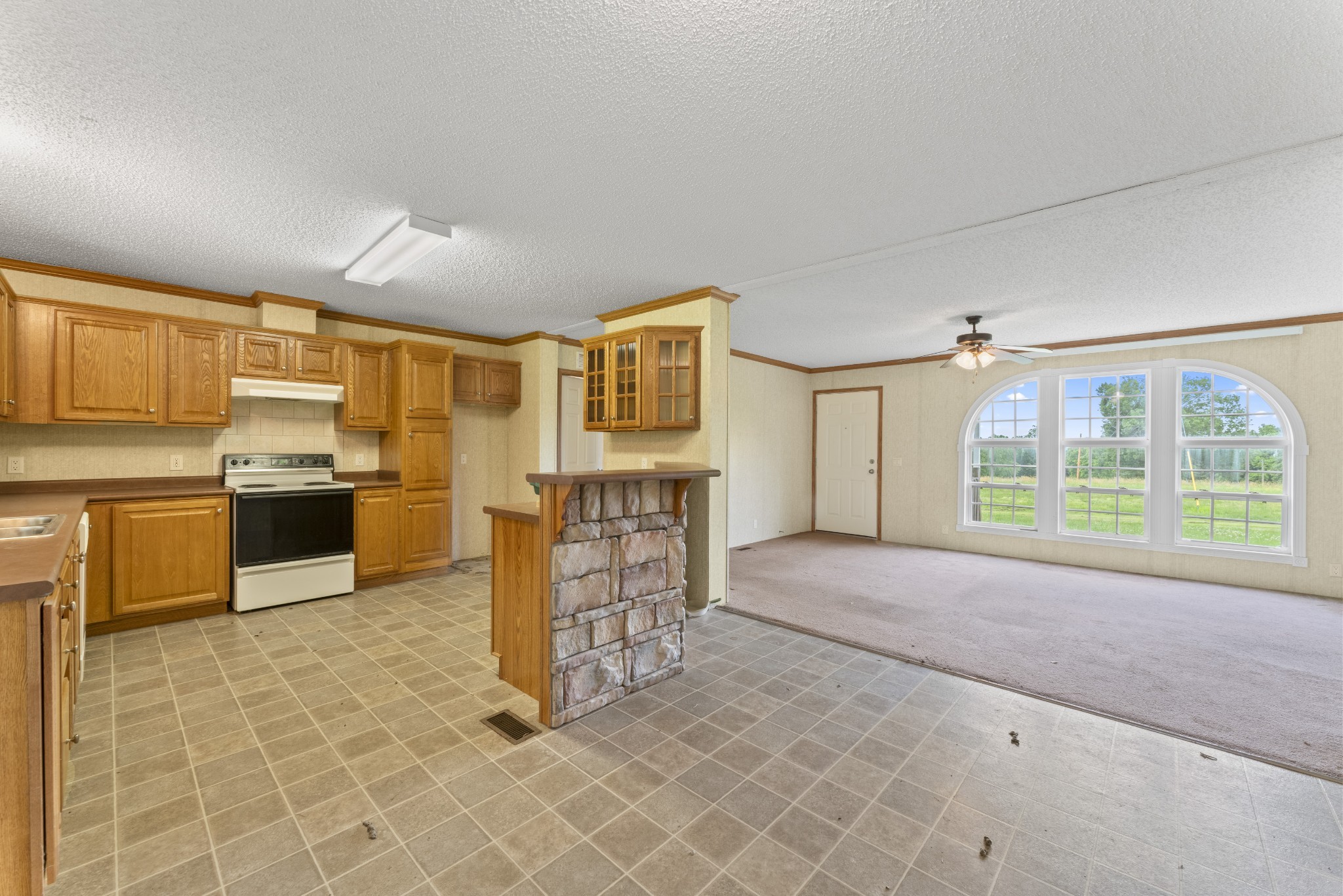 439 Philippi Road Wartrace, TN 37183 - Photo 22 of 29 a kitchen with granite countertop a sink cabinets and stainless steel appliances