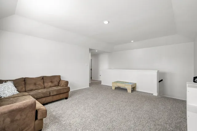 a living room with furniture and a couch