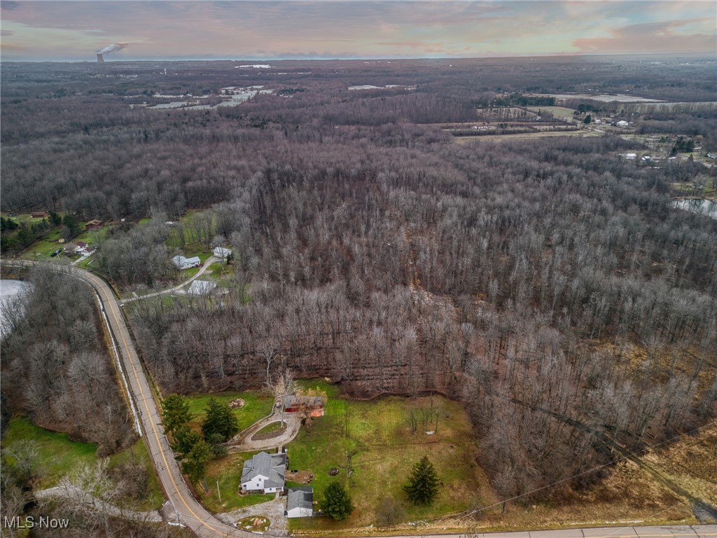 15594 Moseley Road Madison, OH 44057 - Photo 3 of 7 Aerial view at dusk of a wooded view