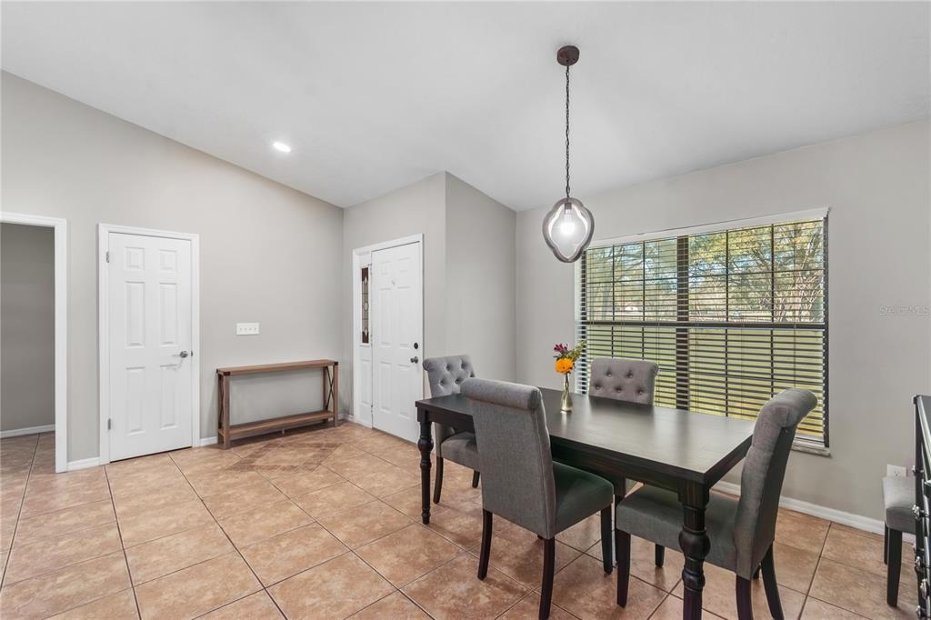10 Carry Back Road Ocala, FL 34482 - Photo 12 of 69 a view of a dining room with furniture window and wooden floor