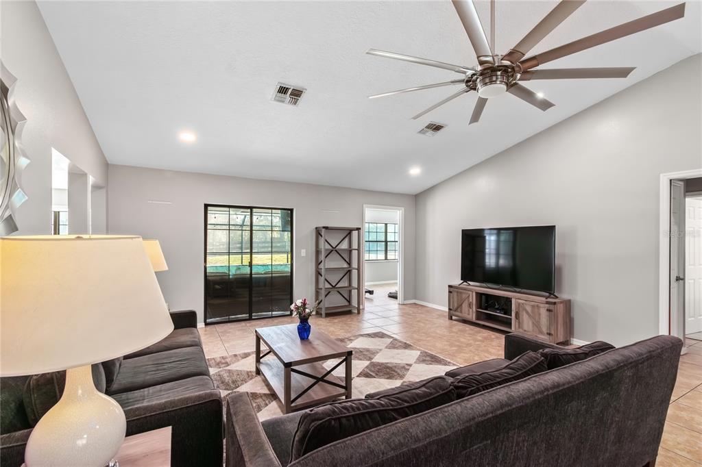 10 Carry Back Road Ocala, FL 34482 - Photo 14 of 69 a living room with furniture and a flat screen tv