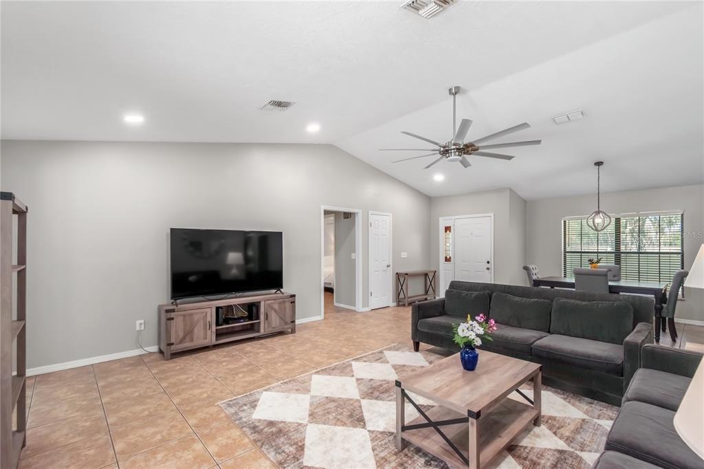 10 Carry Back Road Ocala, FL 34482 - Photo 15 of 69 a living room with furniture and a flat screen tv