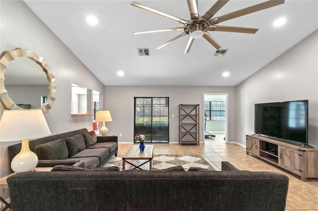 10 Carry Back Road Ocala, FL 34482 - Photo 17 of 69 a living room with furniture and a flat screen tv