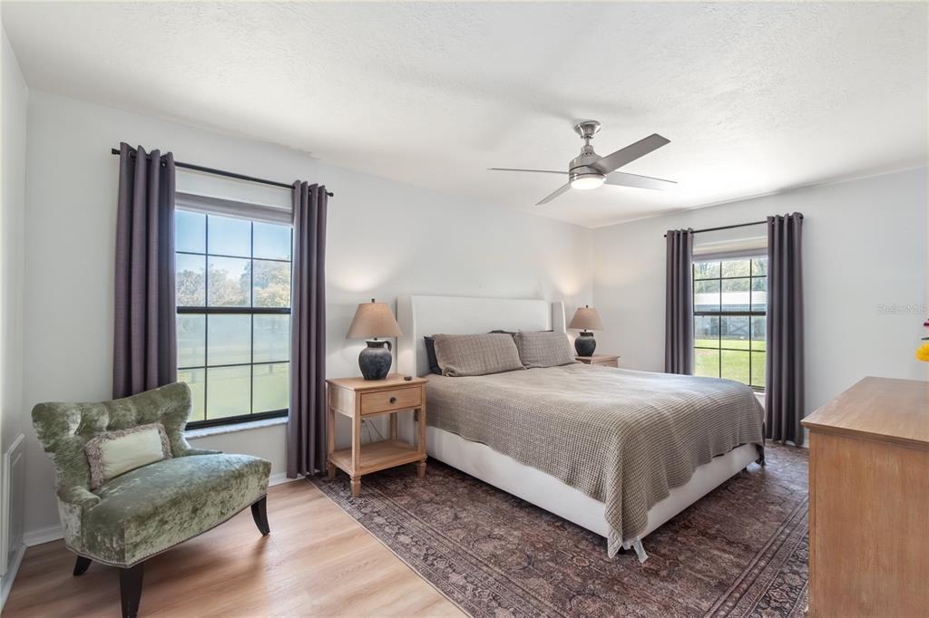 10 Carry Back Road Ocala, FL 34482 - Photo 22 of 69 a bedroom with a bed and a couch