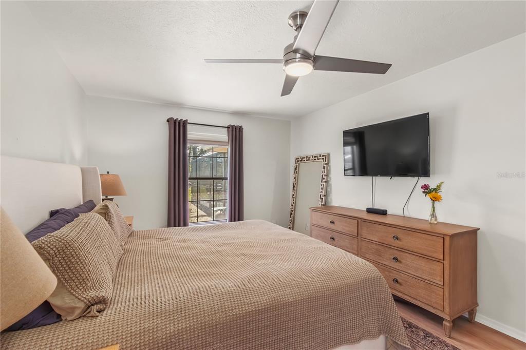 10 Carry Back Road Ocala, FL 34482 - Photo 23 of 69 a bedroom with a bed and a flat screen tv