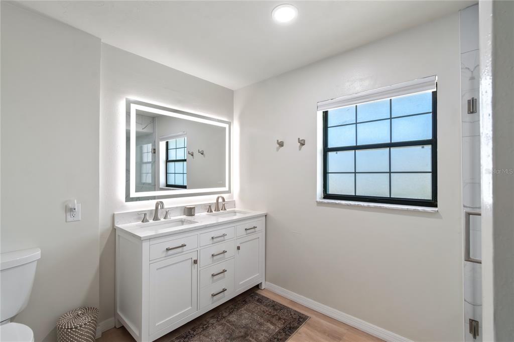 10 Carry Back Road Ocala, FL 34482 - Photo 25 of 69 a bathroom with a toilet sink and mirror