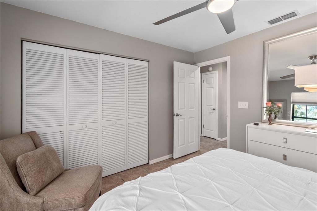 10 Carry Back Road Ocala, FL 34482 - Photo 30 of 69 a bedroom with a bed couch and window