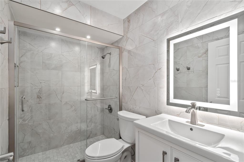 10 Carry Back Road Ocala, FL 34482 - Photo 31 of 69 a bathroom with a sink a toilet and shower