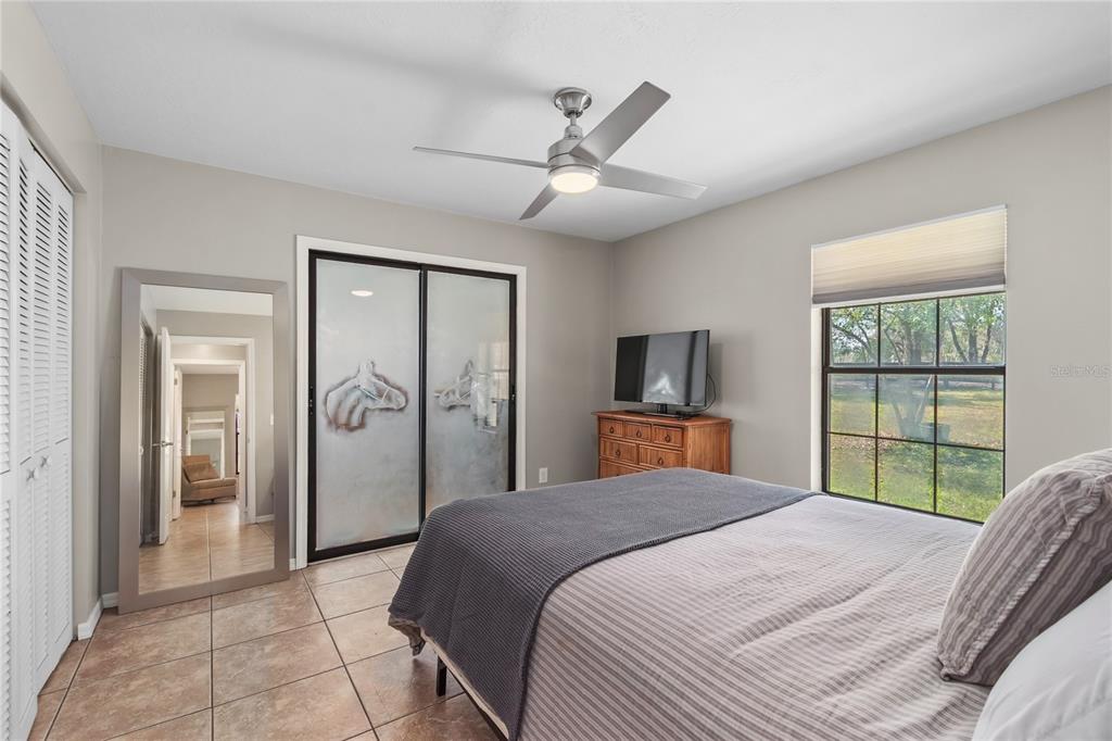 10 Carry Back Road Ocala, FL 34482 - Photo 32 of 69 a bedroom with a large bed and a window