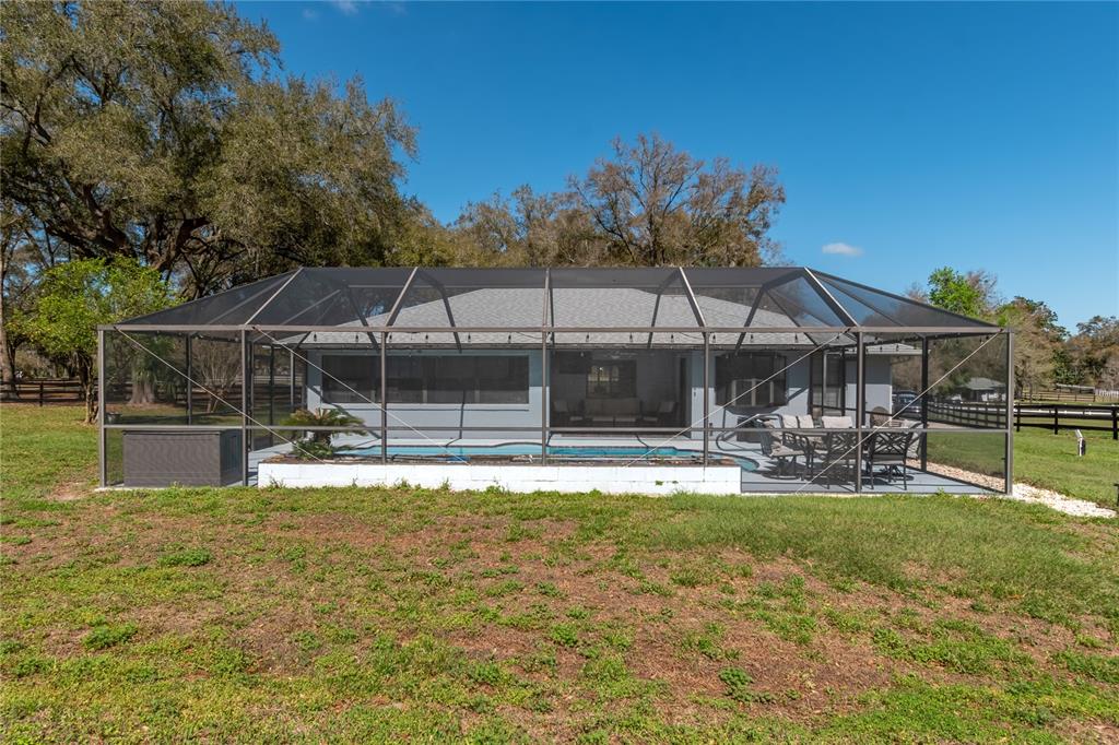 10 Carry Back Road Ocala, FL 34482 - Photo 45 of 69 a view of house with garden and patio