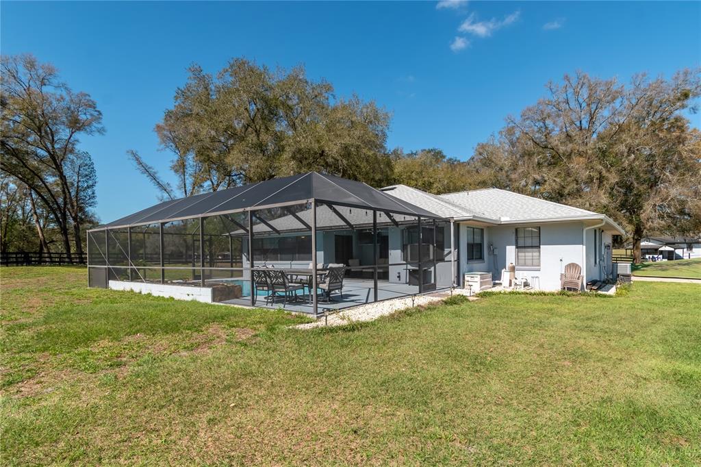 10 Carry Back Road Ocala, FL 34482 - Photo 46 of 69 a view of a house with a yard and sitting area