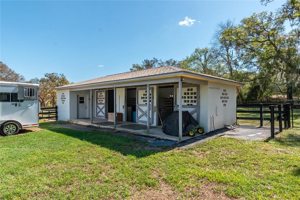 10 Carry Back Road Ocala, FL 34482 - Photo 49 of 69 a view of a house with a yard and sitting area