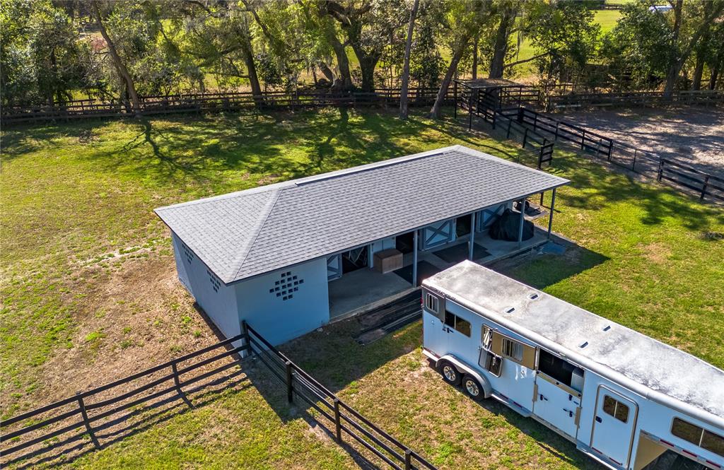 10 Carry Back Road Ocala, FL 34482 - Photo 62 of 69 an aerial view of a house with swimming pool and large trees