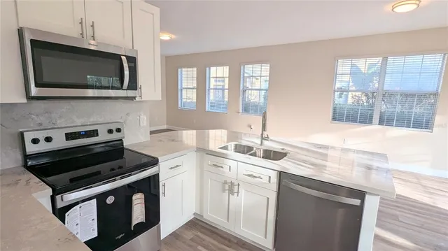a kitchen with a stove and a microwave