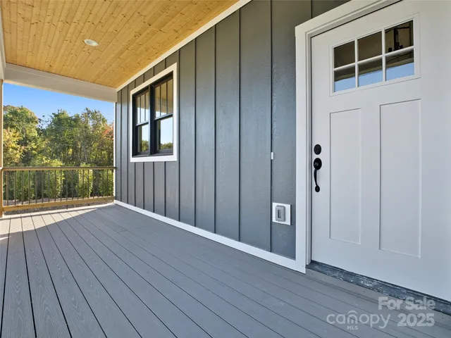 a view of a balcony with wooden floor