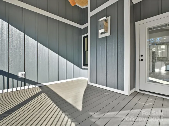 an aerial view of a house with a swimming pool