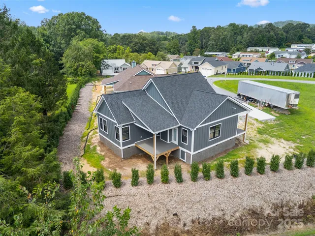 an aerial view of a house with a garden
