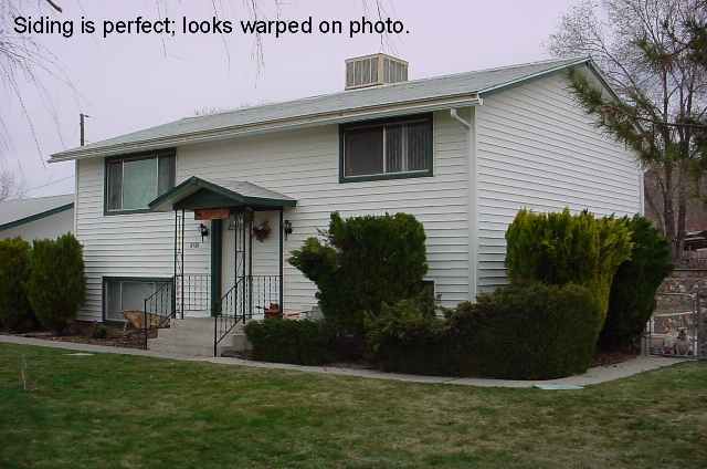 8980 Limnol Street Reno, NV 89506 - Photo 1 of 2 a front view of a house with garden