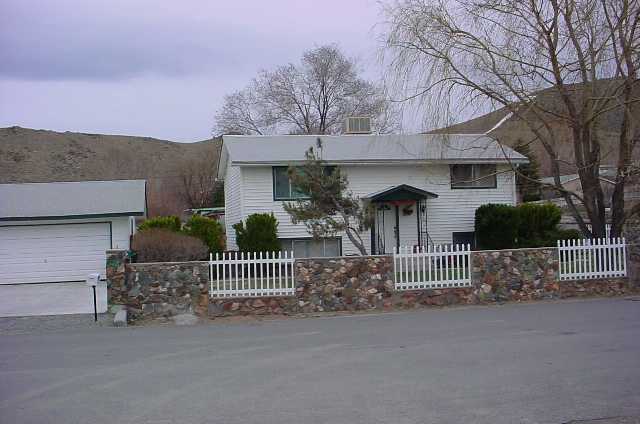 8980 Limnol Street Reno, NV 89506 - Photo 2 of 2 a view of a house with a street