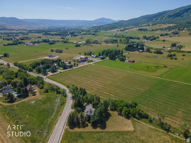 2807 North Ogden Canyon Road Eden, UT 84310 - Photo 63 of 72 Expansive rural landscape featuring a single-family residence, mature trees, and agricultural fields
