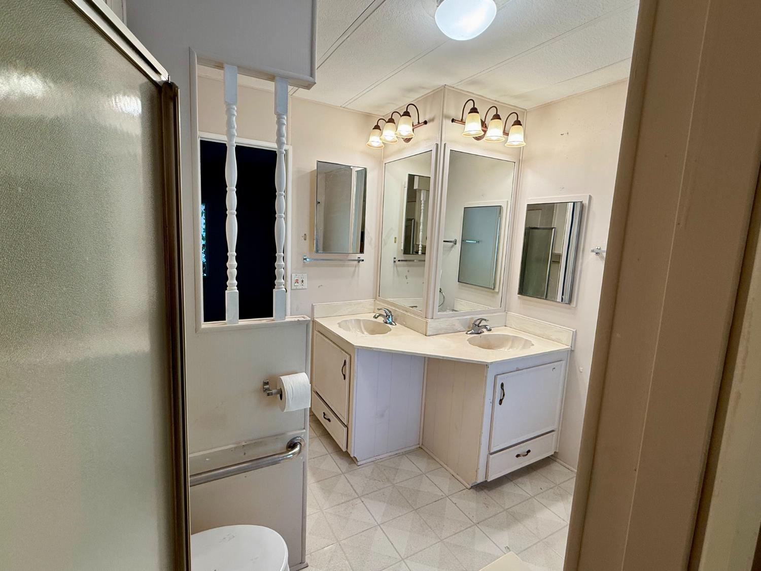 2958 Spring View Lane Placerville, CA 95667 - Photo 13 of 23 a bathroom with a sink vanity mirror and bathtub