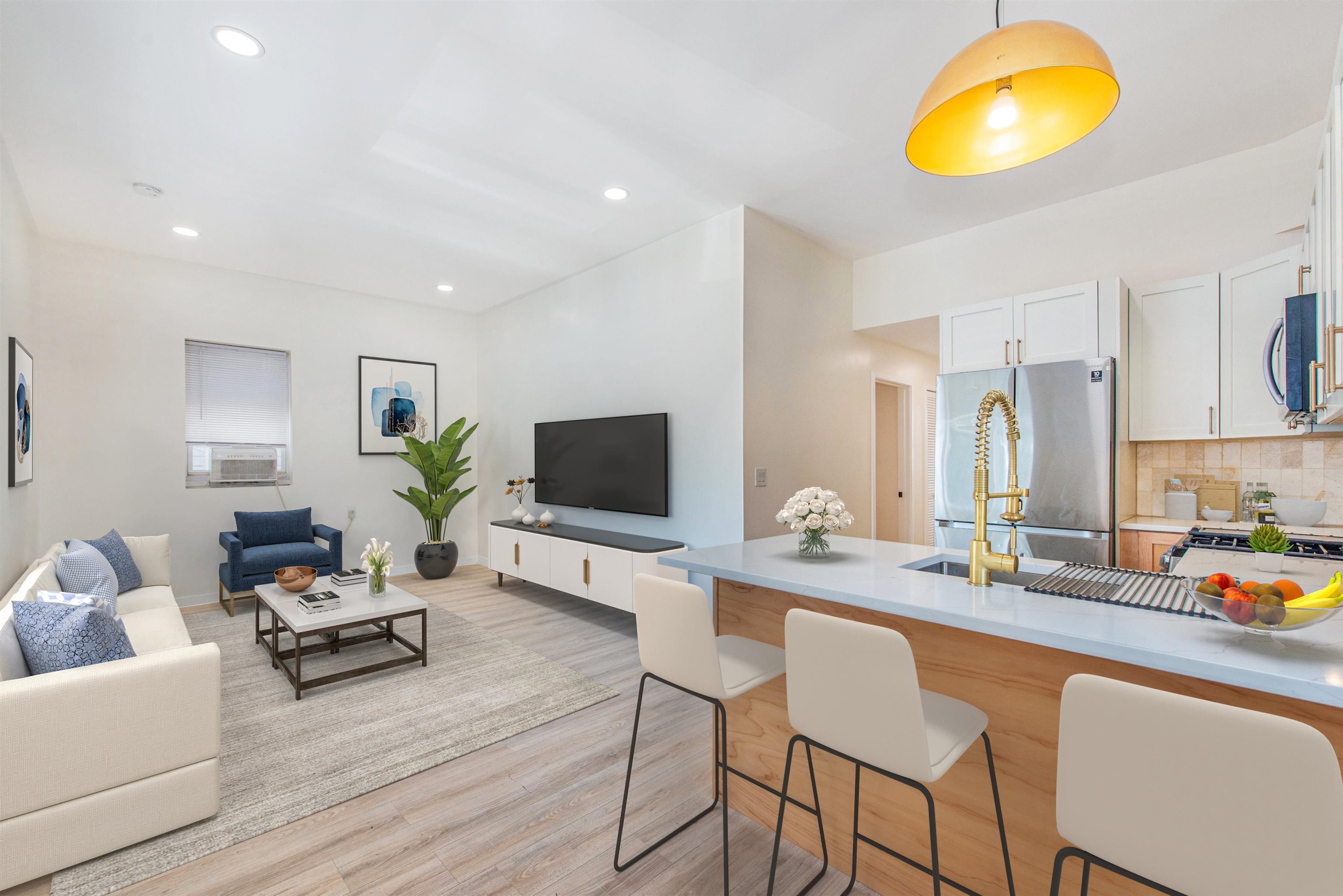 a living room with furniture and a flat screen tv