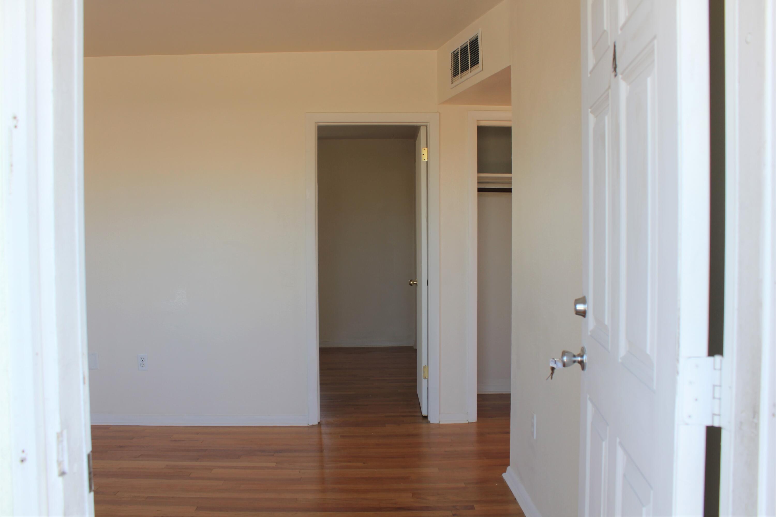 651 Palm Drive, Unit A4 Satellite Beach, FL 32937 - Photo 2 of 16 a view of a hallway with wooden floor