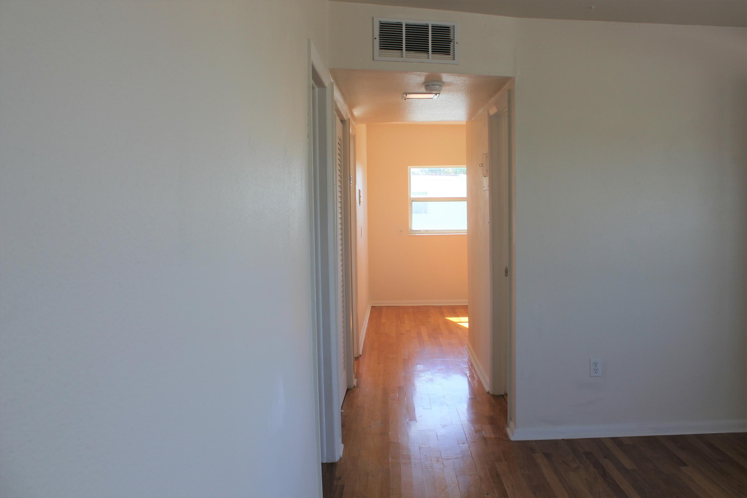 651 Palm Drive, Unit A4 Satellite Beach, FL 32937 - Photo 5 of 16 a view of empty room with wooden floor