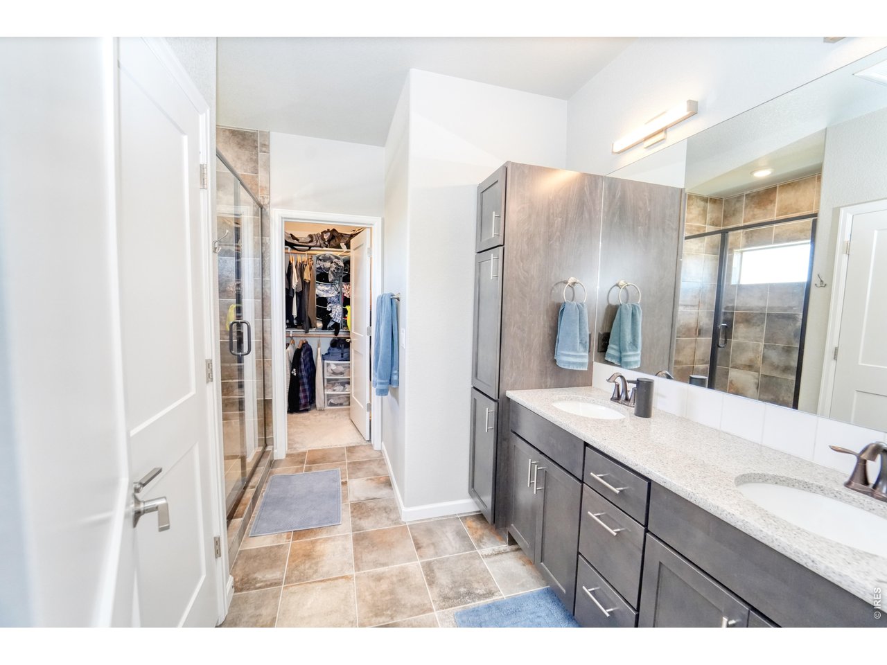13388 Positano Point Colorado Springs, CO 80921 - Photo 13 of 26 a bathroom with a sink and a mirror