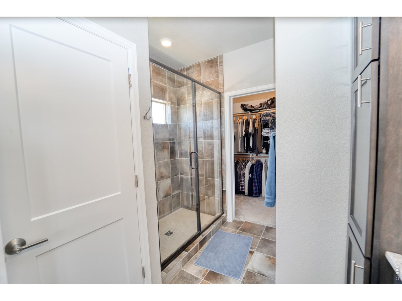 13388 Positano Point Colorado Springs, CO 80921 - Photo 15 of 26 a bathroom with a shower and a glass door