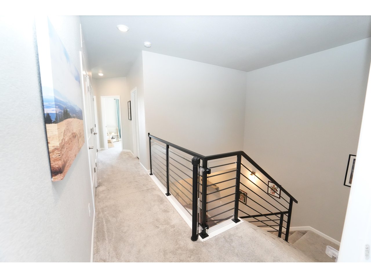 13388 Positano Point Colorado Springs, CO 80921 - Photo 17 of 26 a view of a hallway with seating area