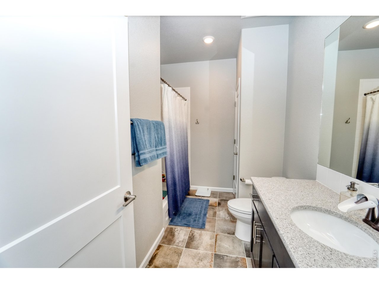 13388 Positano Point Colorado Springs, CO 80921 - Photo 19 of 26 a bathroom with a sink and a mirror