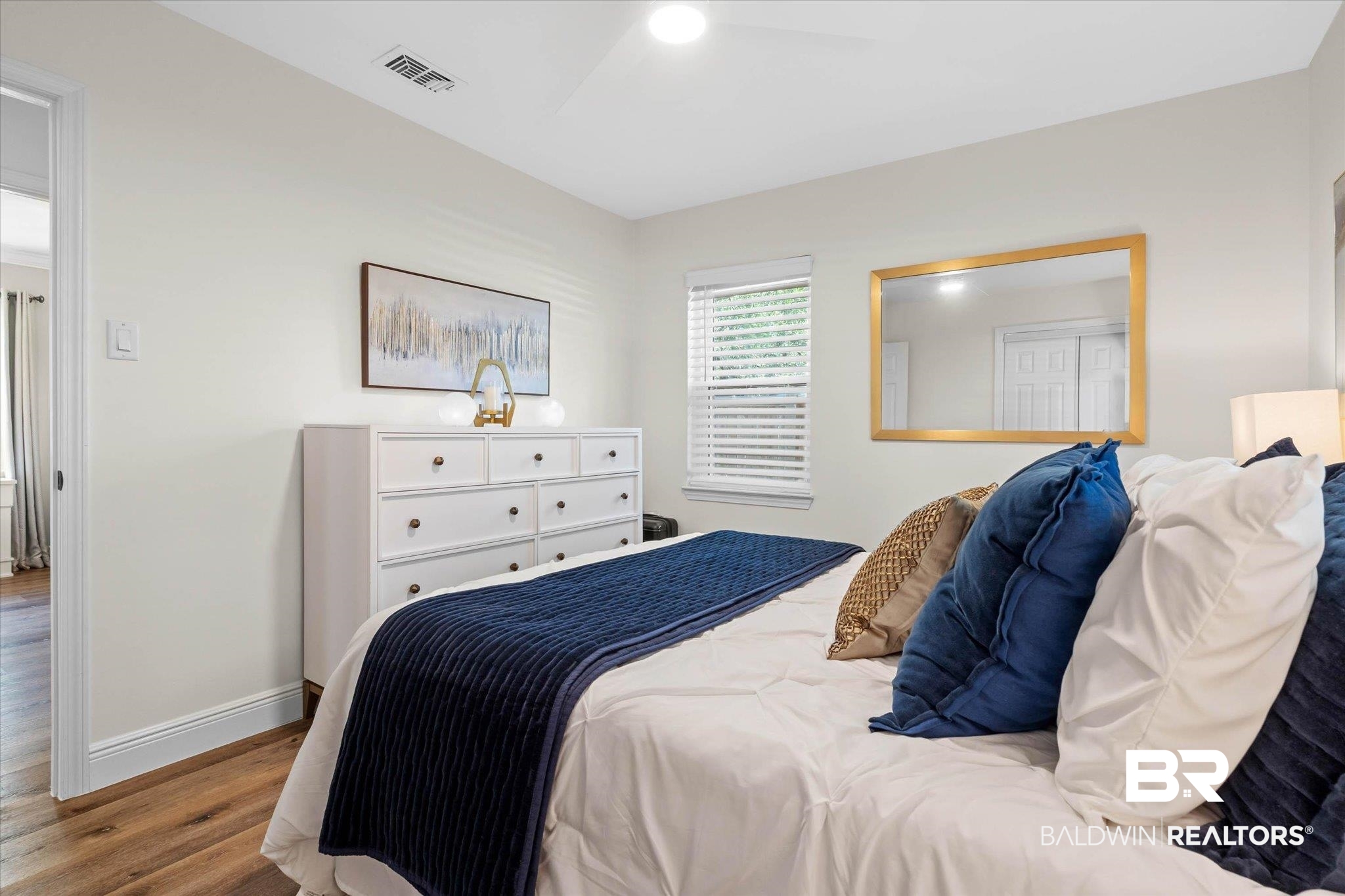 101 Ann Street Daphne, AL 36527 - Photo 18 of 38 Room featuring wood-finish flooring, light-toned walls, and a ceiling fan with integrated lighting