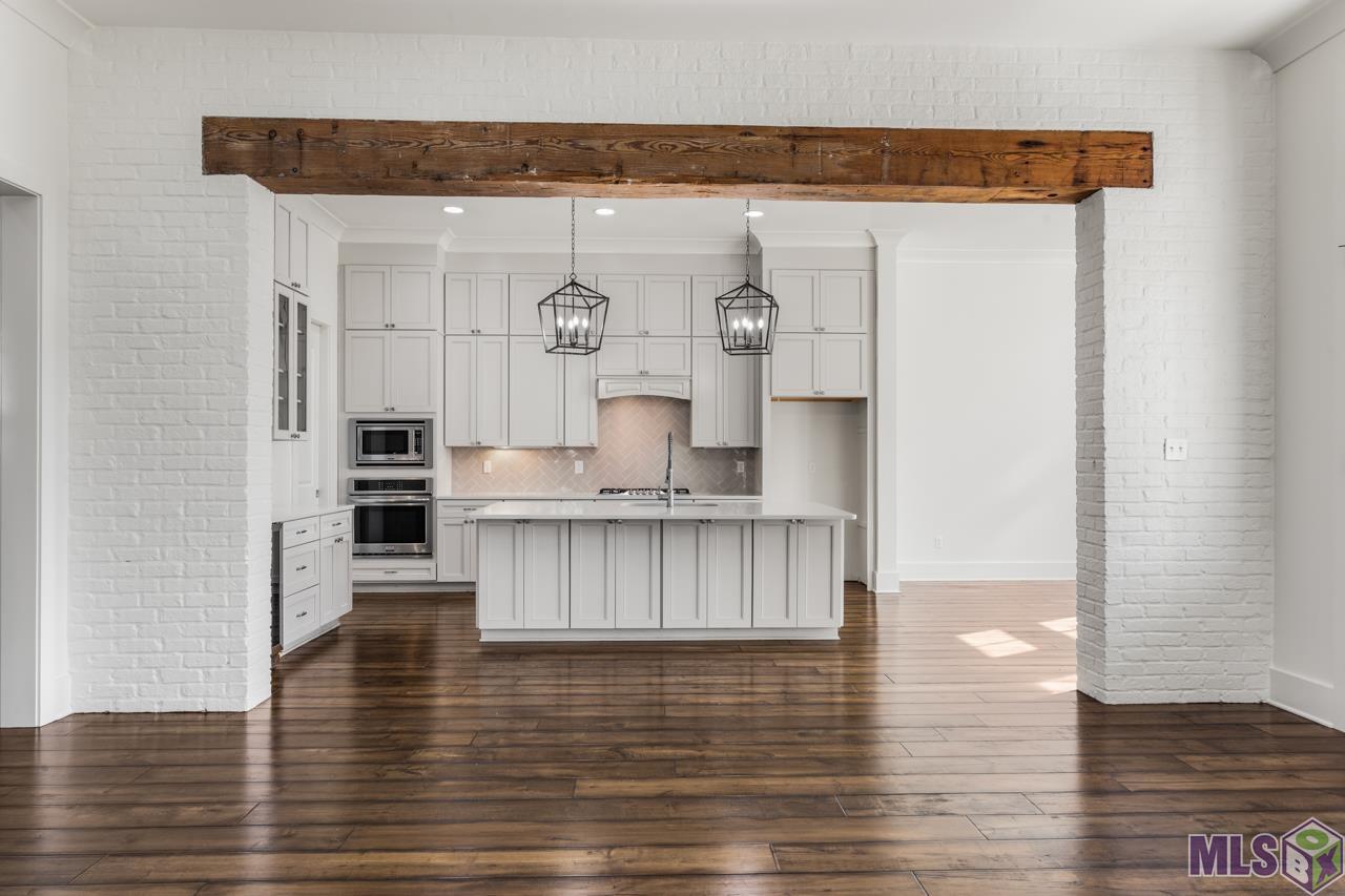 10740 Summer Fest Lane Baton Rouge, LA 70810 - Photo 9 of 34 Kitchen with old wood beam
