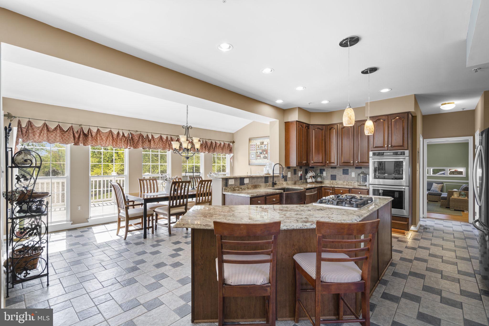 15307 Riding Path Court Laurel, MD 20707 - Photo 12 of 75 Kitchen with bar stool seating
