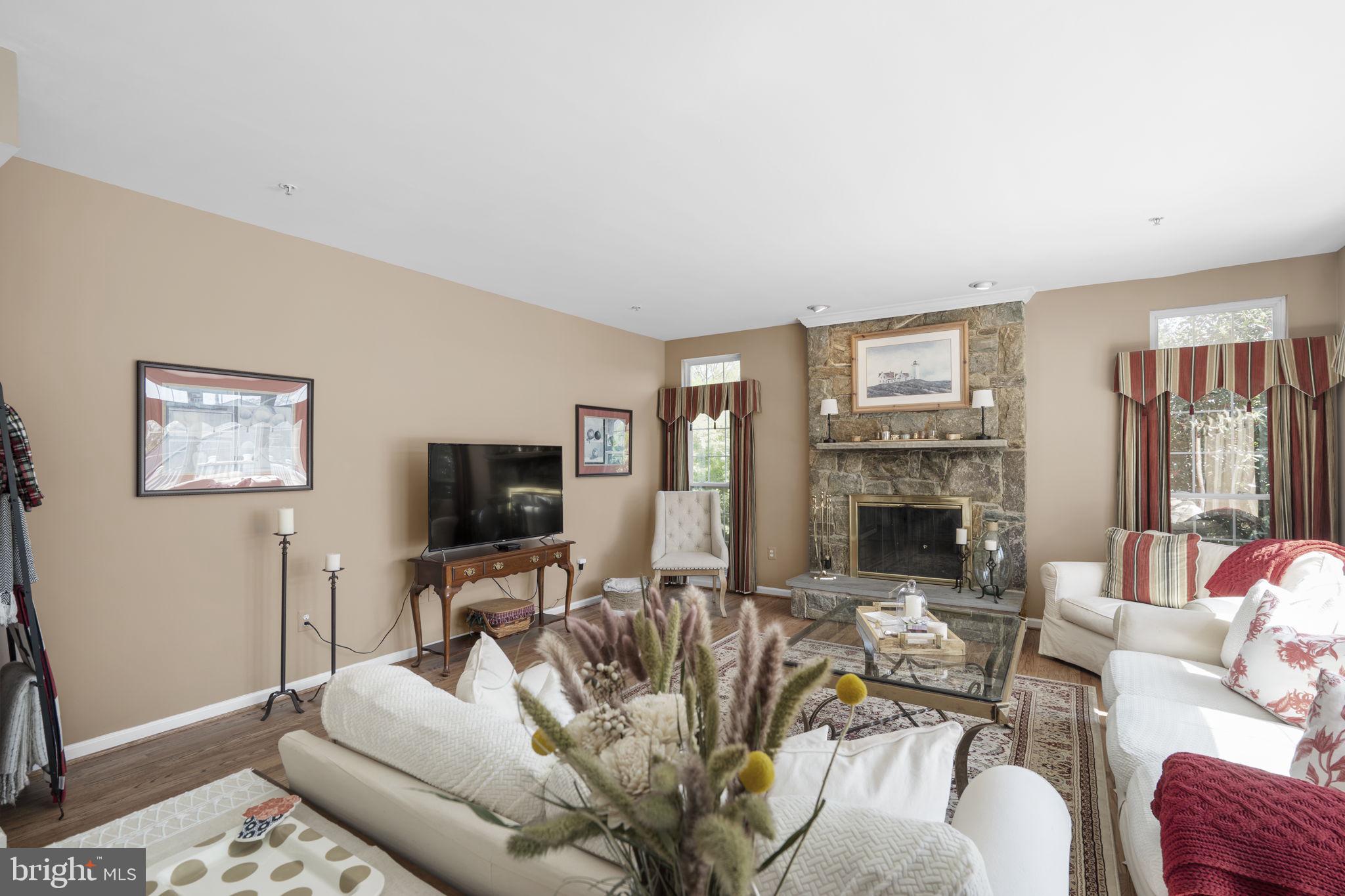 15307 Riding Path Court Laurel, MD 20707 - Photo 16 of 75 Family room with stone surround fireplace