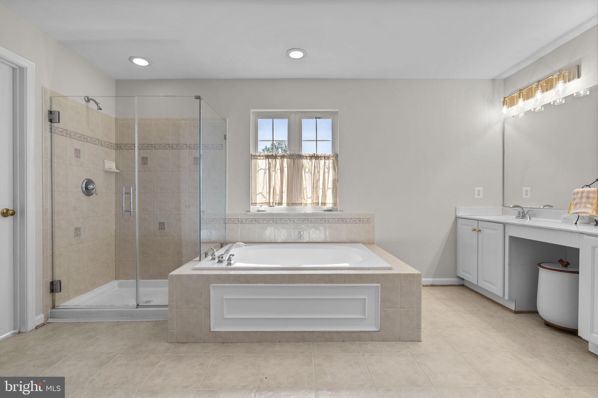 15307 Riding Path Court Laurel, MD 20707 - Photo 31 of 75 Soaking tub & frameless shower