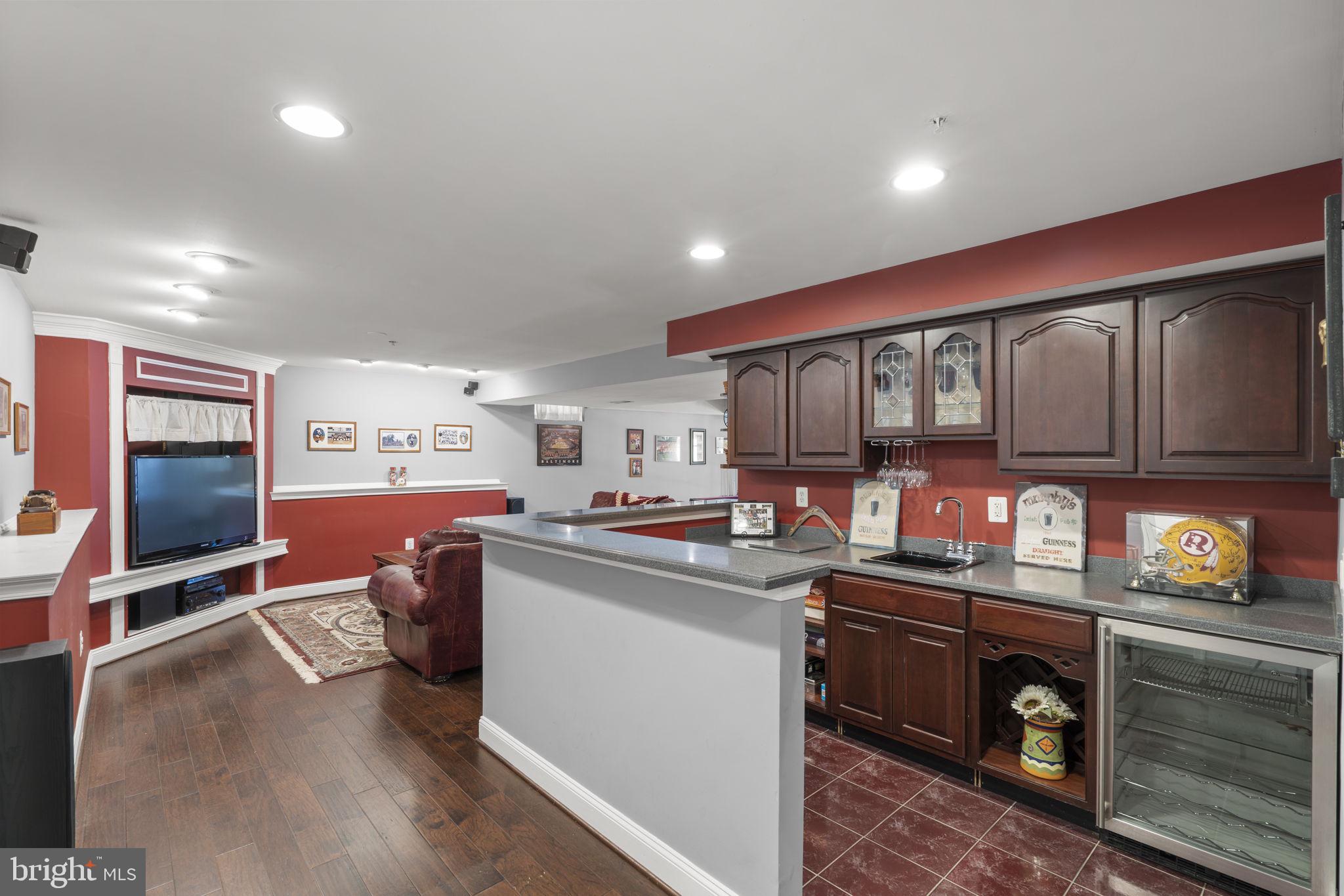 15307 Riding Path Court Laurel, MD 20707 - Photo 41 of 75 Finished basement with wet bar & rec room