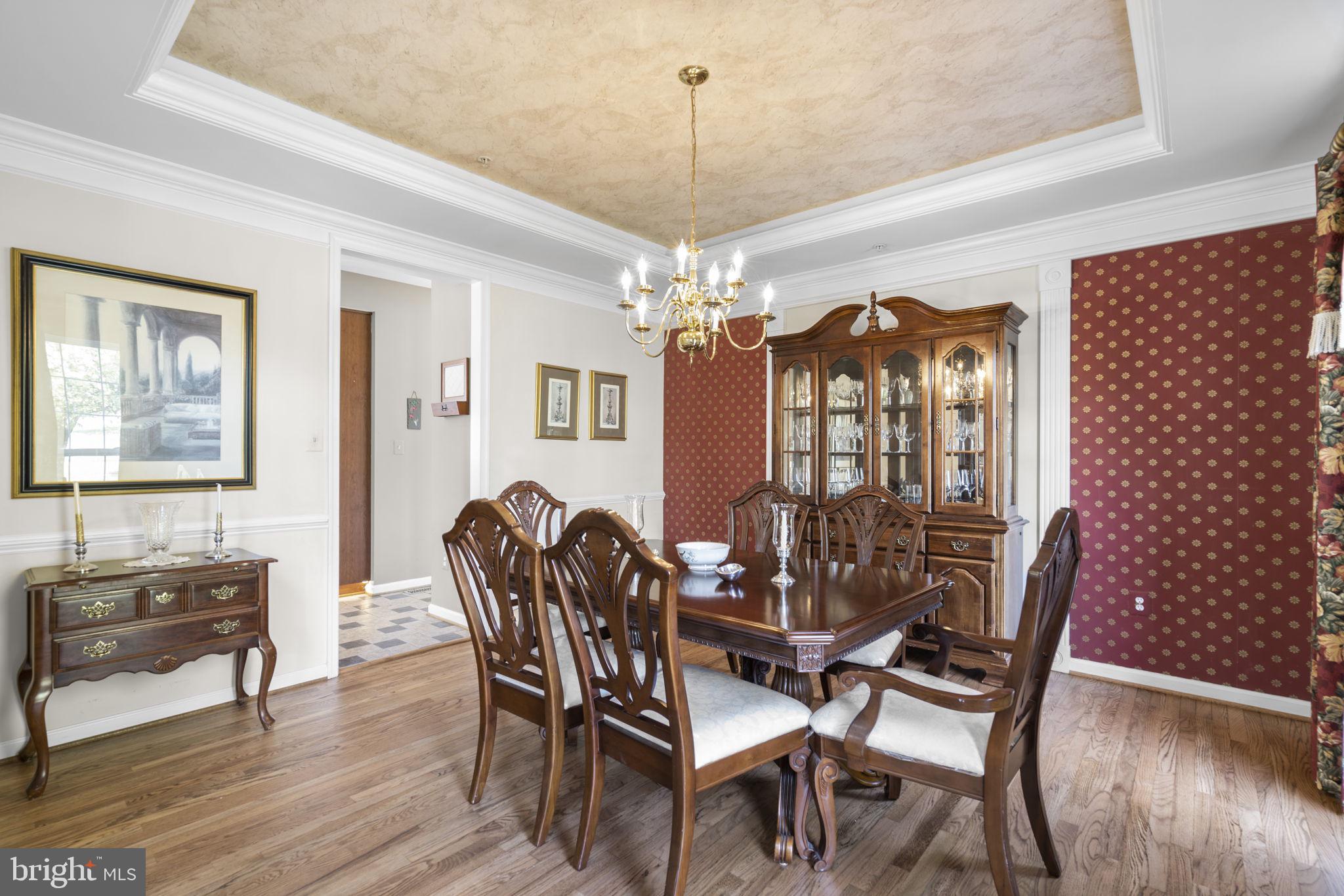 15307 Riding Path Court Laurel, MD 20707 - Photo 6 of 75 Dining room with tray ceiling & hardwood flooring