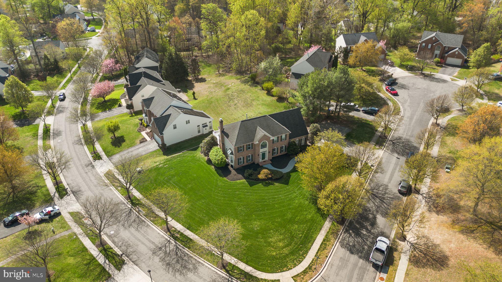 15307 Riding Path Court Laurel, MD 20707 - Photo 65 of 73 an aerial view of a house with a garden and swimming pool