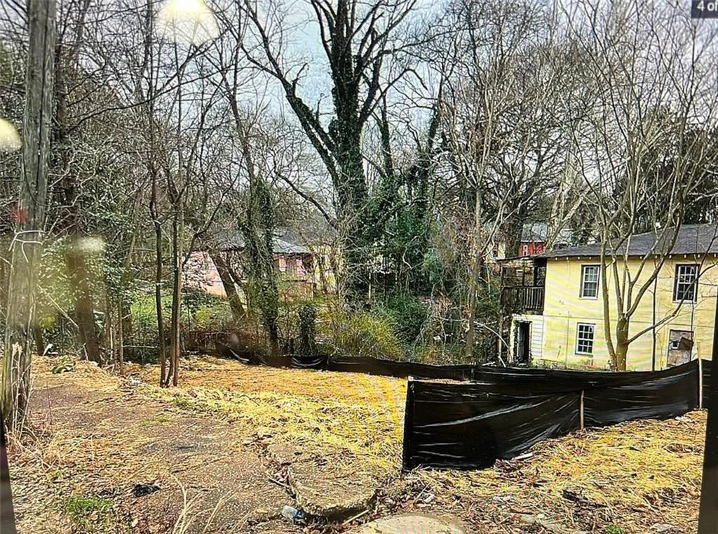 459 Paines Avenue Northwest Atlanta, GA 30318 - Photo 22 of 23 a view of a yard covered in snow