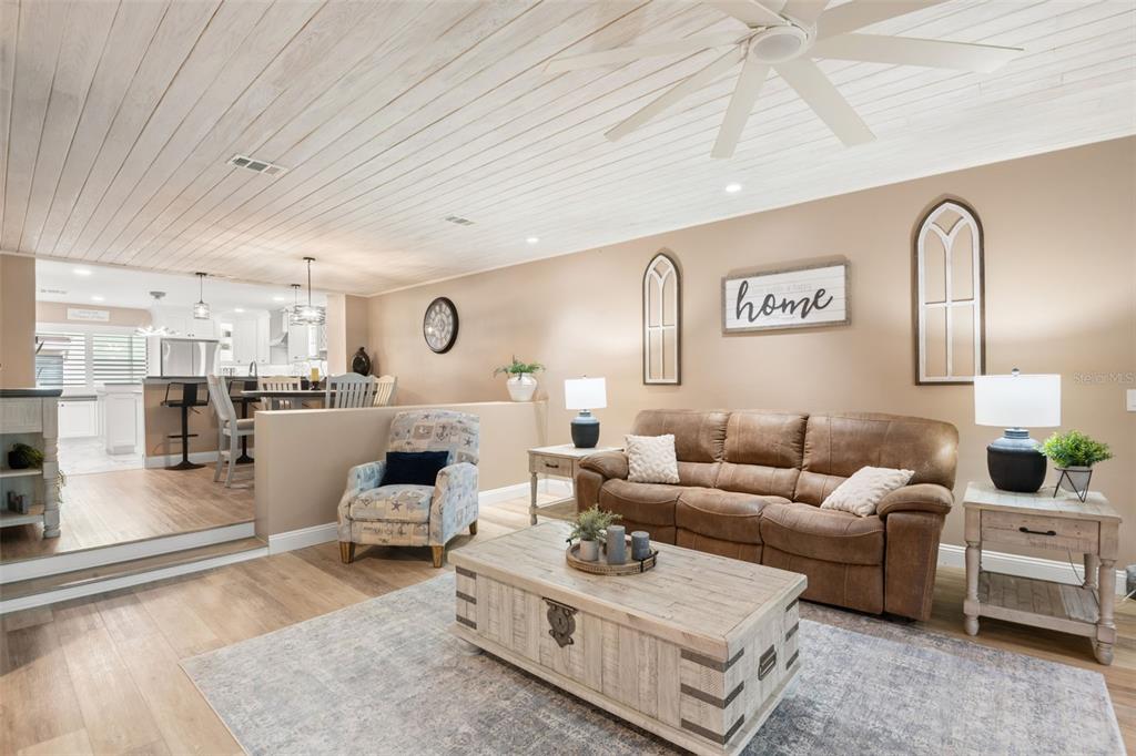 529 Sandy Hook Road Treasure Island, FL 33706 - Photo 9 of 55 a living room with furniture and wooden floor