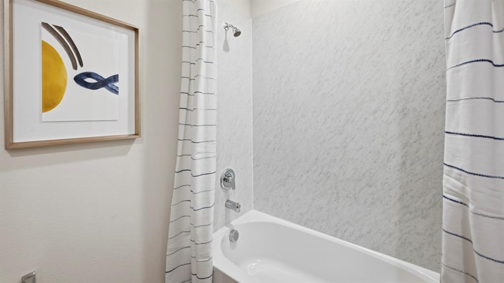 3427 Spur Run Sherman, TX 75090 - Photo 2 of 36 a bathroom with a bathtub and shower