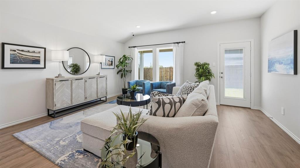 3427 Spur Run Sherman, TX 75090 - Photo 29 of 36 a living room with furniture a window and wooden floor